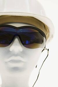 Mannequin wearing safety glasses and a helmet