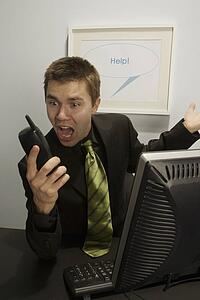 Businessman screaming into a phone