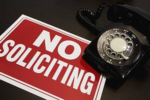 No soliciting sign with a telephone