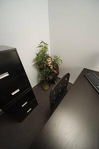 Businessman hiding in an office