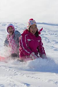 Children tobogganing