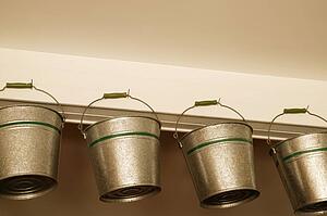 Low angle view of hanging buckets