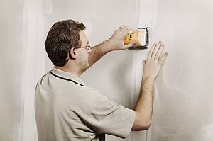 Man using a sander