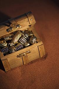 Golden beads in a box