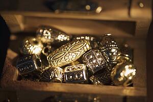 Golden beads in box