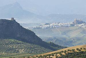 The Iron Castle - (Castillo de Hierro) at Pruna, Seville with the hilltop village of Olvera, Cadiz, in the background. 