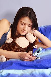 Teenager using a cell phone