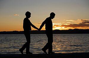 Couple walking by the water
