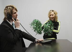 Businessman On Phone Beside Cheerleader