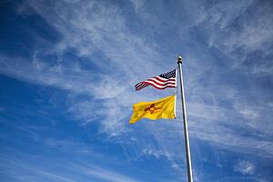American flag and New Mexico flag on flag pole 