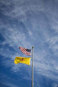 American flag and New Mexico flag on flag pole 