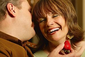 Couple whispering and laughing