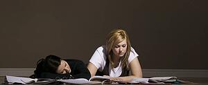 Two women studying and sleeping