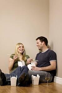 Couple eating on the floor