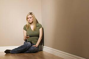 Woman sitting with wine glass