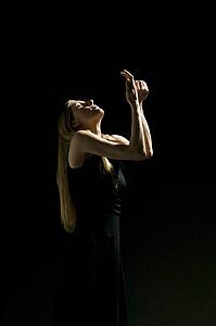 Woman holding hands up