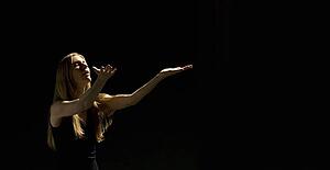 Woman holding arms out 