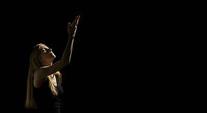 Woman with one arm up 