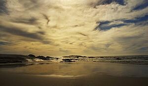 Sand and ocean at sunset