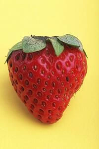 Strawberry on yellow background