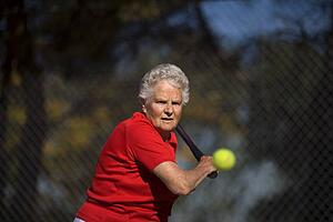 Woman ready to hit tennis ball