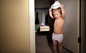 Little boy playing with underwear
