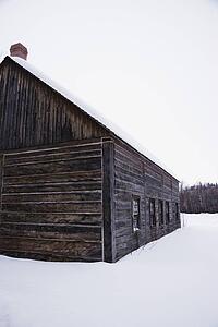 Wooden building in snow