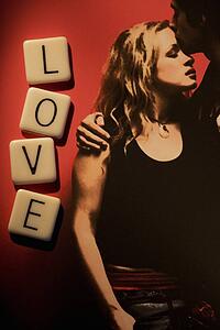 Couple embracing with word "love"
