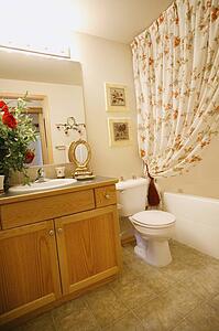 Bathroom in a home with shower, toilet and sink