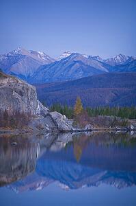 Fall evening mountain reflection in water 