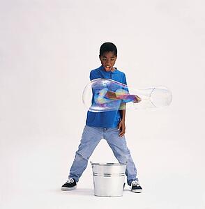 Boy making bubbles