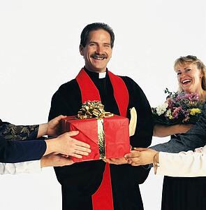 Priest receiving gifts
