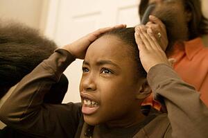 Girl having hair done 