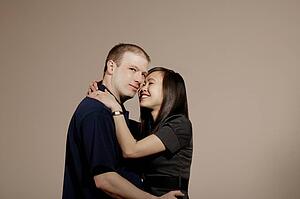 A man and woman embracing and smiling