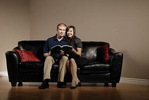 Couple reading together on the couch