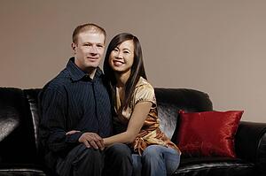 Couple sitting close on couch