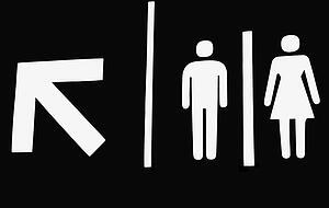 Washroom sign with arrow