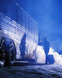 Woman getting on bus in winter