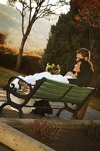 A couple on a bench in autumn