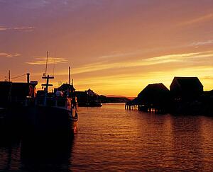 Sunset on fishing harbor