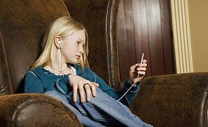 Teenage girl listening to music