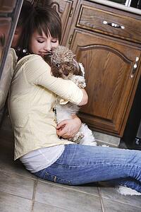 Woman holding a dog