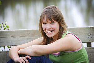 Portrait of a woman smiling outdoors