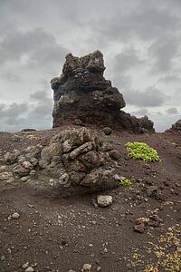 Clouds over volcanic rock formation 