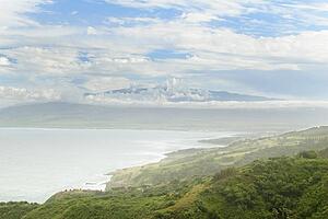 Distant view of Maui's Haleakala crater with white clouds in Hawaii, USA 