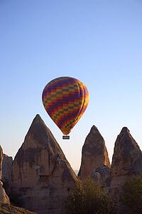 Hot air balloon flying over Goreme valley, Cappadocia, Anatolia, Turkey 