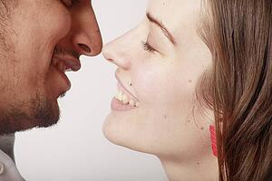 Profile of a couple about to kiss