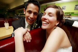 A couple sitting and laughing