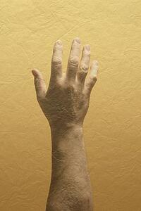 A person's hand raised in worship