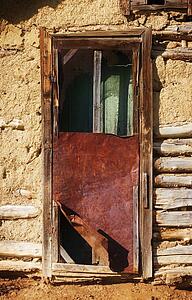 Broken door at an empty house